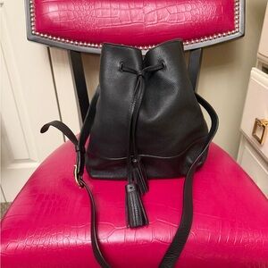 Black leather bucket style crossbody bag